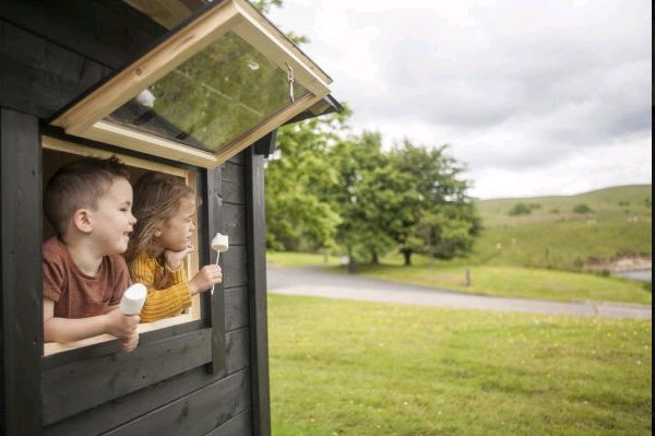 Kielder Lodges children looking out of window